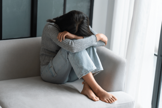 Woman with back pain with emotional distress